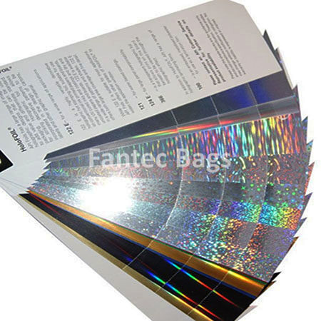 Array of holographic and metallic foil cards fanned out, showing rainbow, silver, and gold finishes