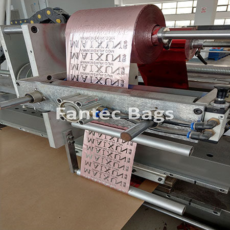 "Industrial printing machine producing branded film labels with precision rollers and guides."