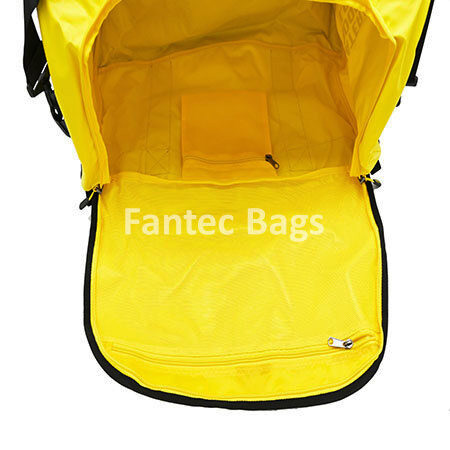 Compartment display of yellow gym bag with black trim, showing spacious main compartment and inner pocket