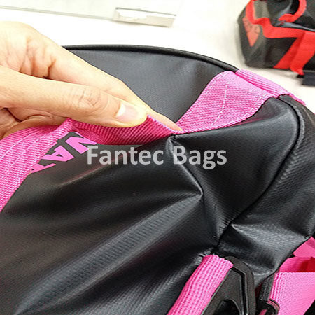 "Close up inspection of PVC bag ribbon connection showing stitching and material quality."