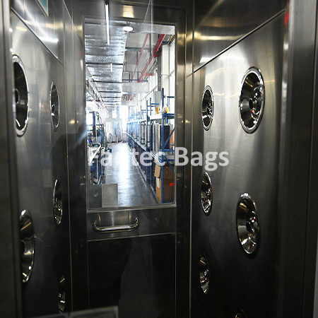 "Stainless steel blower entrance chamber ensuring dust free thermal paper manufacturing environment."
