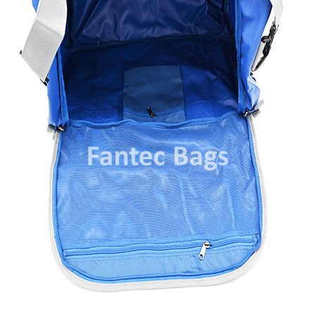Eye view of camber interior showing mesh pocket, zippered compartments, and spacious storage inside blue PVC holdall bag