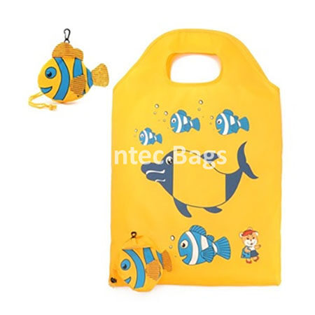 "Bright yellow foldable shiny nylon bag with ocean themed whale and fish design, lightweight and reusable."