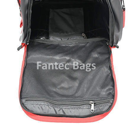Inner perspective of red and black travel bag showing mesh pocket, zippered compartments, and spacious interior