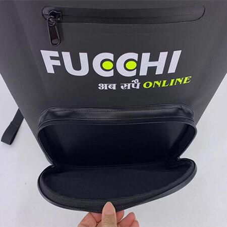 "Insulated cooler backpack with front pocket open, showing compartments and branded graphics."