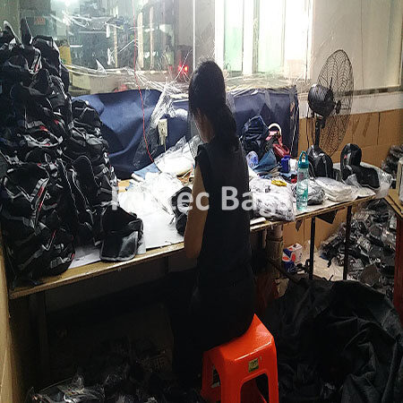 "Cluttered table showing waterproof PVC bag production process."
