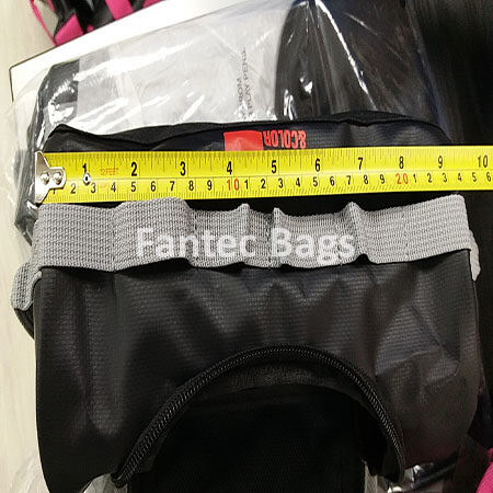 "Tape measure confirming width of waterproof PVC bag for catalog accuracy."