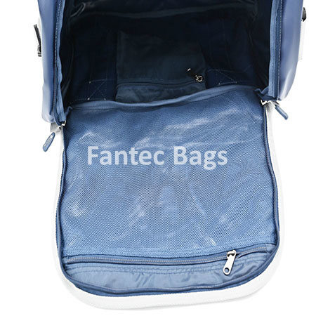 view of blue overnight bag showing mesh pocket, zippered compartments, and spacious interior