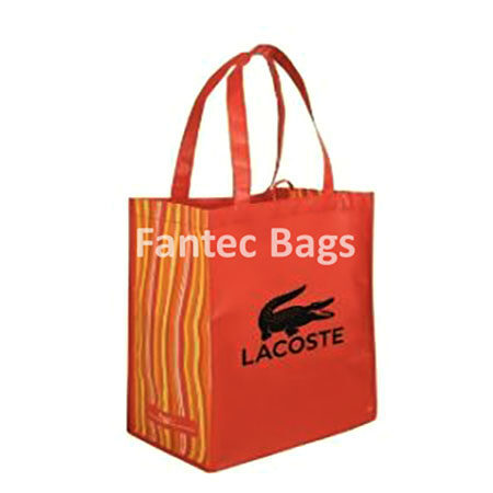 "Eco-friendly orange non woven shopping bag with sturdy handles, designed for retail and promotional use."
