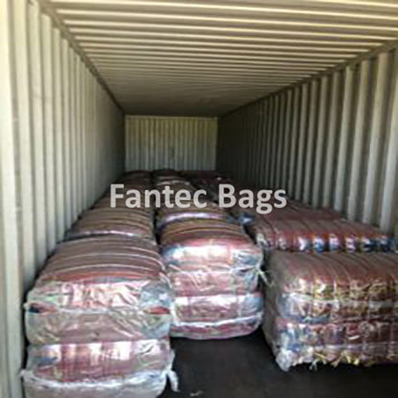 "Organized cotton tote bag packing method specified by client for bulk shipment."