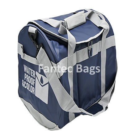 Blue overnight bag with grey straps, multiple compartments, and durable waterproof material