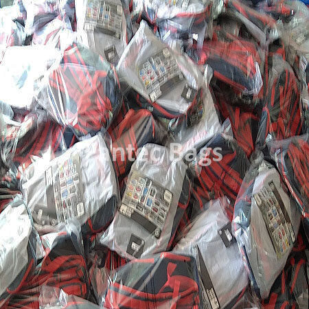 "Bulk packaged PVC backpacks stacked and prepared for boxing."