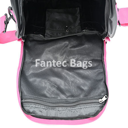 Partition view of pink and black PVC carryall bag showing mesh pocket, zippered compartments, and organized interior