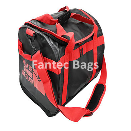 Red and black travel bag with waterproof material, padded shoulder strap, and multiple compartments