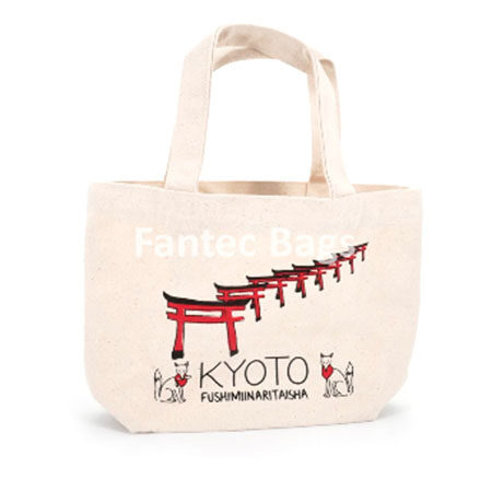 "Japanese torii gates and fox motifs on recycled tote tag."