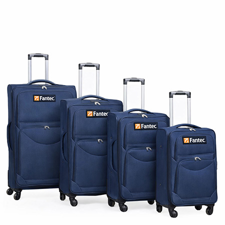 Navy blue rolling suitcase set with telescopic handles, spinner wheels, and multiple zippered compartments