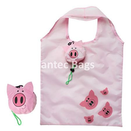 Light pink polyester tote with pig face prints and pig shaped storage pouch