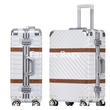Two white suitcases with diagonal ridges, silver corners, and brown accent band